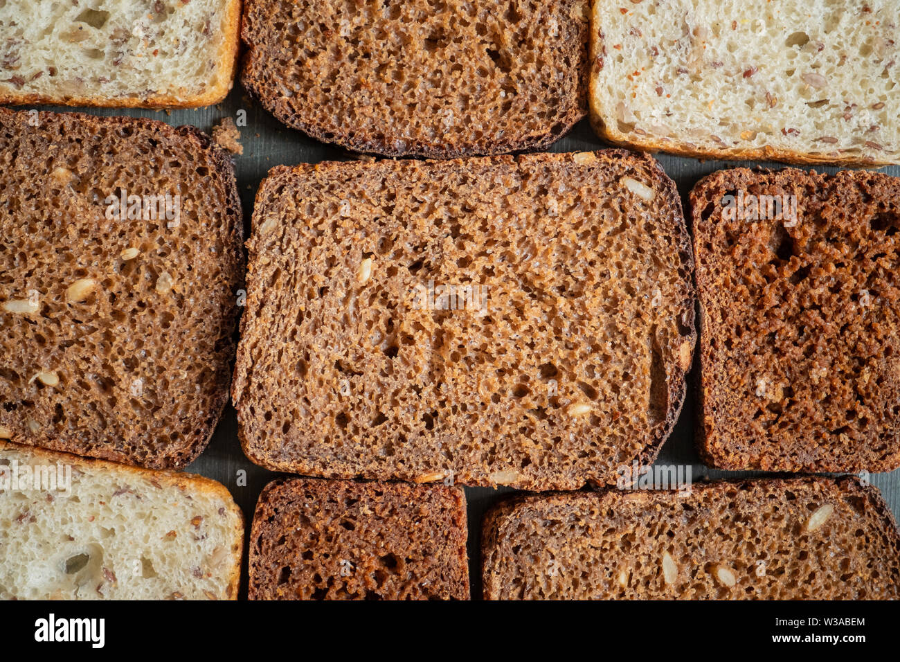 Pattern of wholmeal bread slices. Wholegrain bread with visible detailed texture, diverse types