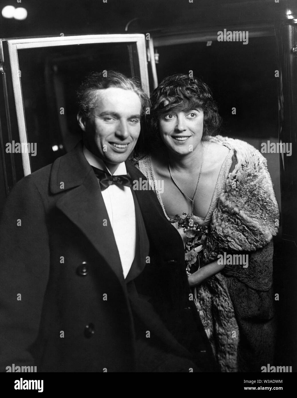 CHARLIE CHAPLIN and MABEL NORMAND candid outside Mission Theatre Los Angeles in 1921 Stock Photo