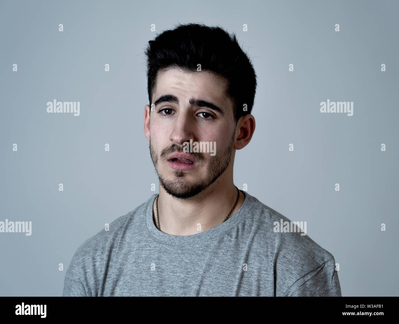 Young sad man happy hi-res stock photography and images - Alamy