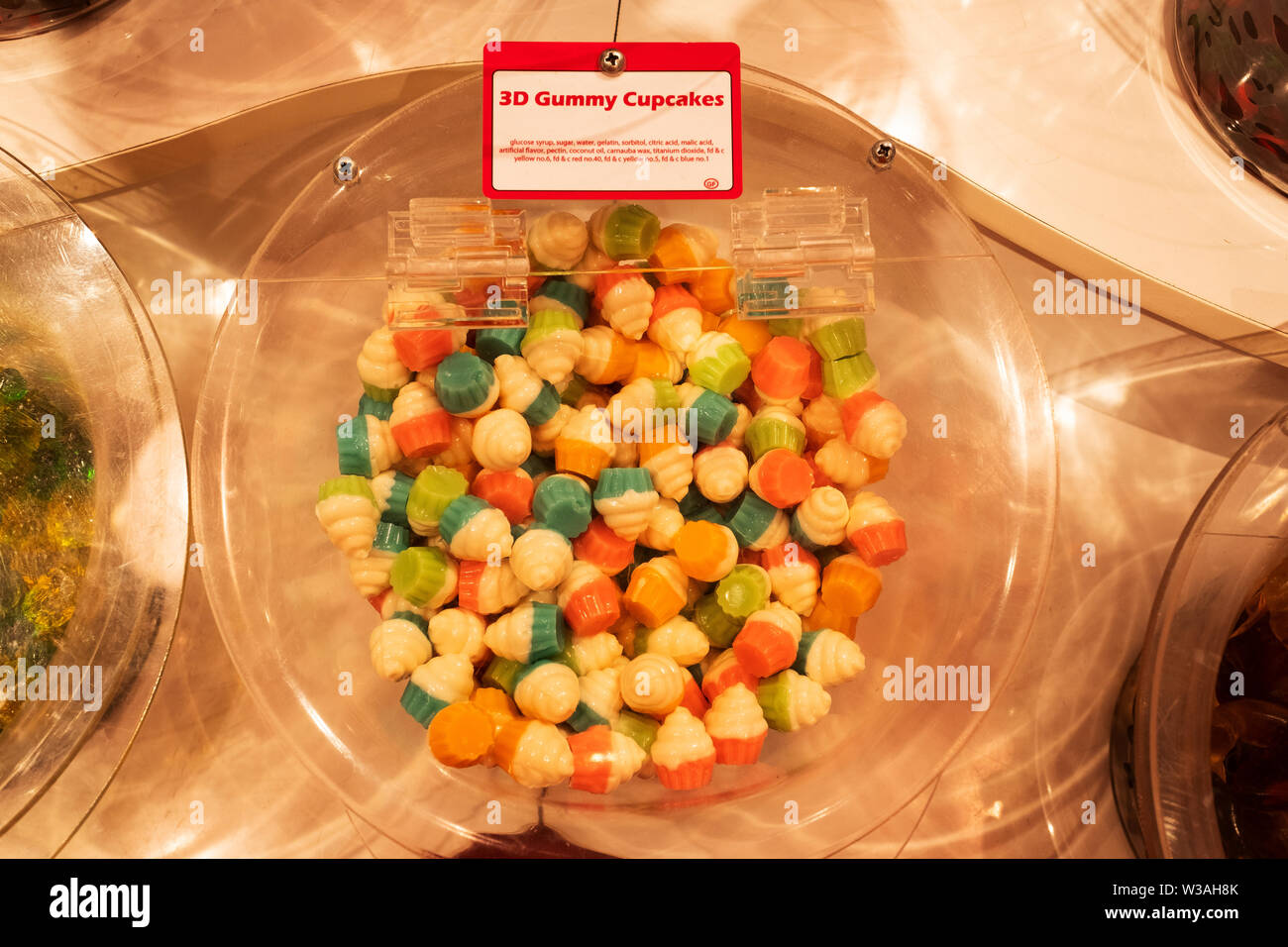3D GUMMY CUPCAKES for sale at It'sugar a by the pound candy store on Broadway in Lower Manhattan, New York City. Stock Photo