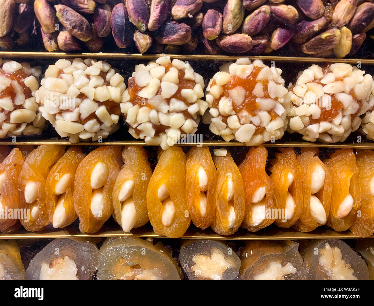 Filled dried fruits (apricot, fig, dates) with nuts, a typical treat and used as a gift in Arabic countries Stock Photo