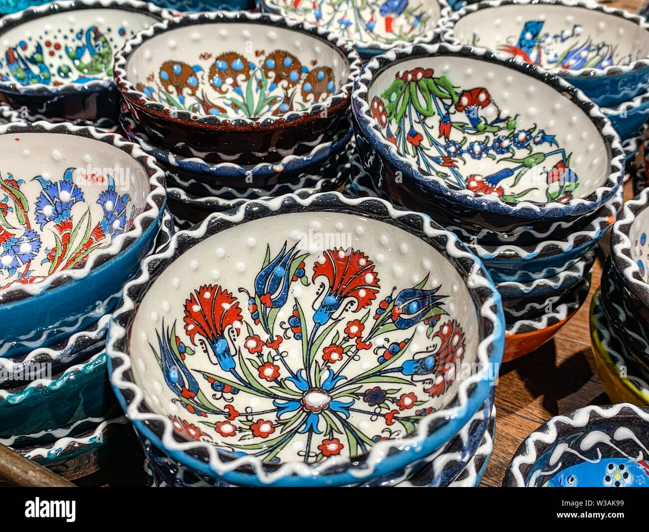 Typical ethnic porcelain bowls on sales with floral and ornamentic pattern. Traditional styled souvenir from Turkey. Stock Photo