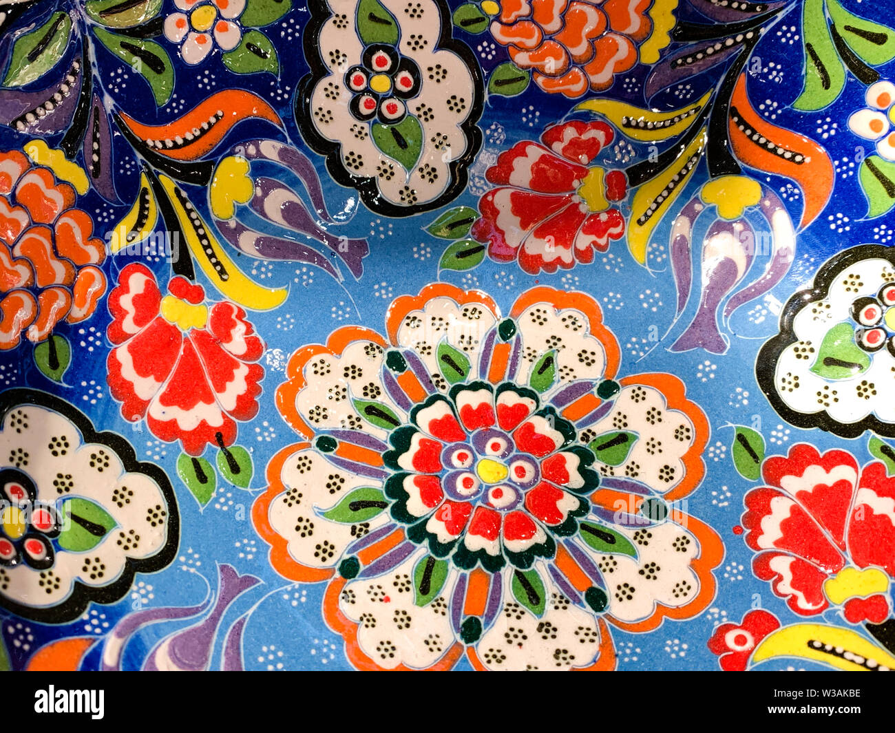 Typical ethnic porcelain bowls on sales with floral and ornamentic pattern. Traditional styled souvenir from Turkey. Stock Photo