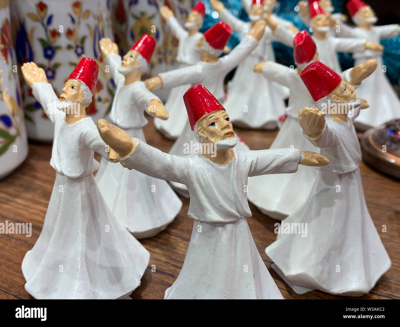 Porcelain figures of Turkish folk dancers, a traditional 'sufi whirling' dance with mediation. Nice gift in a shop as souvenir of Turkey Stock Photo