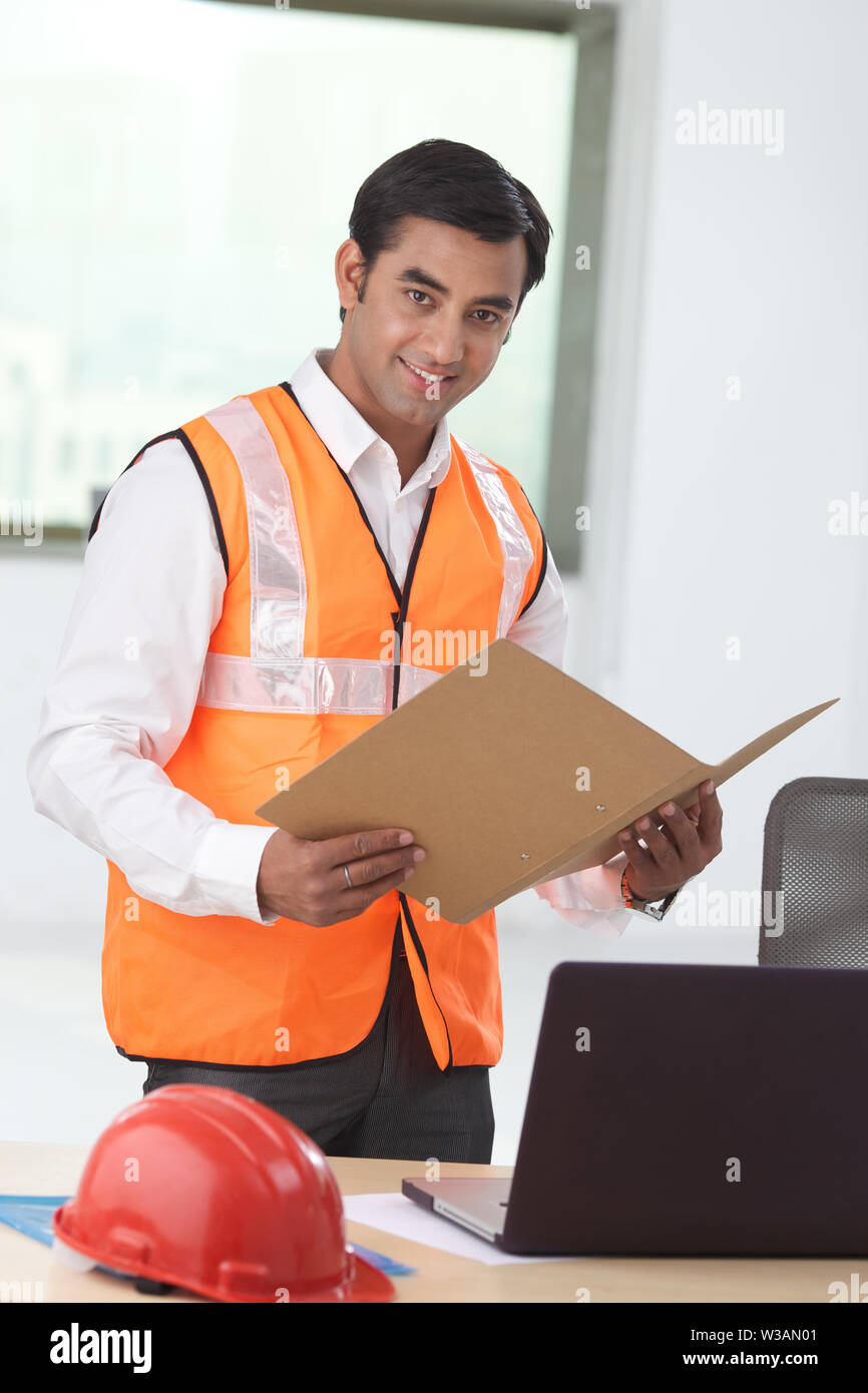 Architect doing paperwork in an office Stock Photo