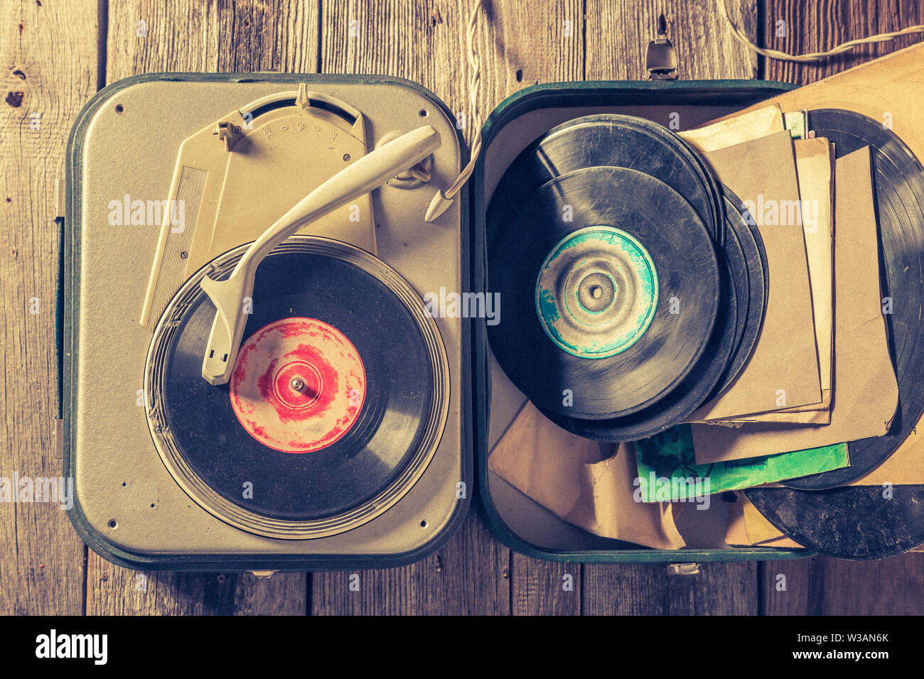 Old gramophone with few black vinyl records Stock Photo - Alamy