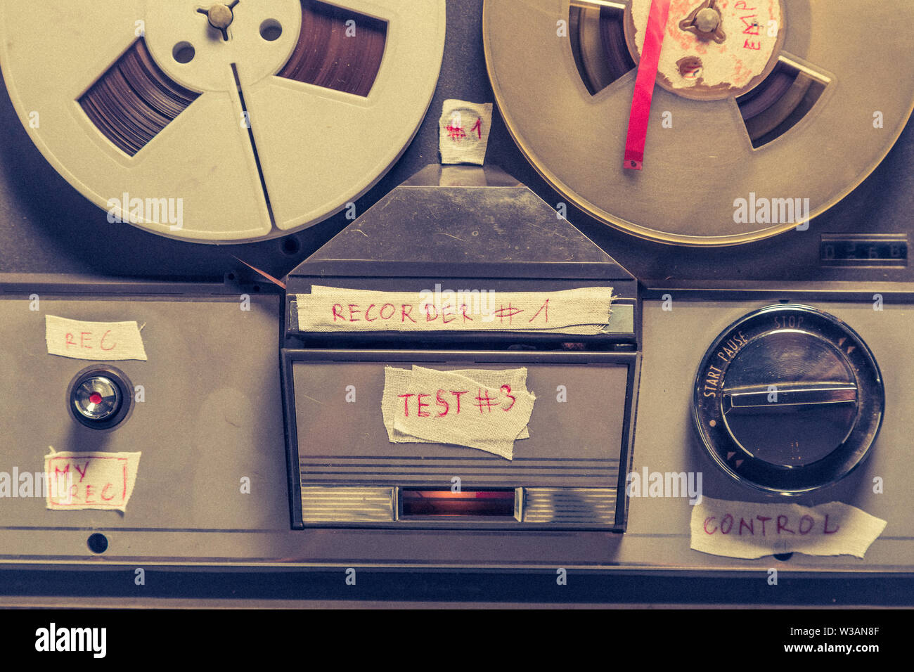 Old audio reel recorder with roll of tape and microphone Stock Photo - Alamy