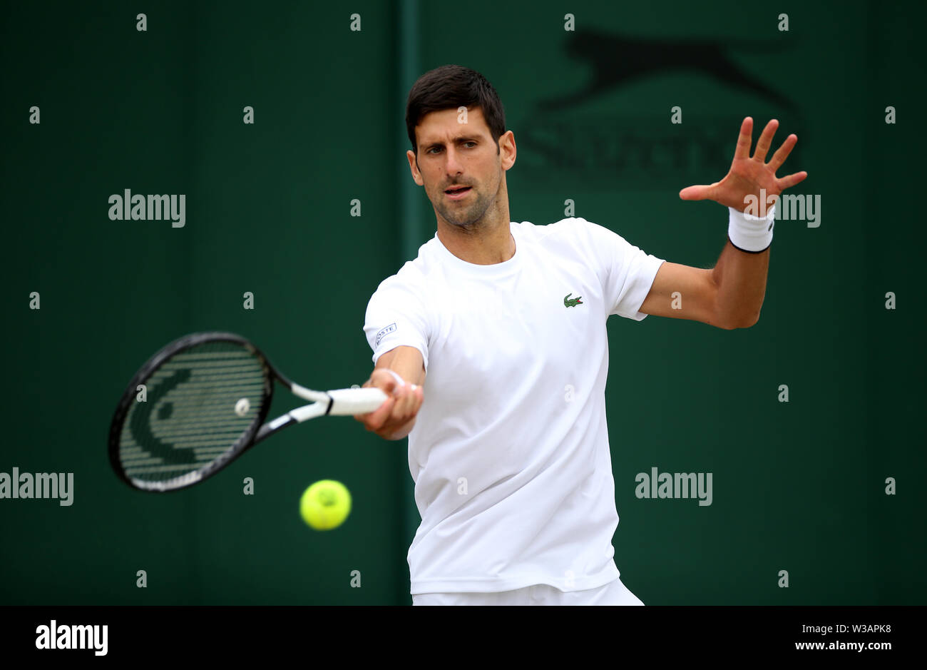 Novak Djokovic during a practice session ahead of the men's singles final on day thirteen of the Wimbledon Championships at the All England Lawn Tennis and Croquet Club, Wimbledon. Stock Photo