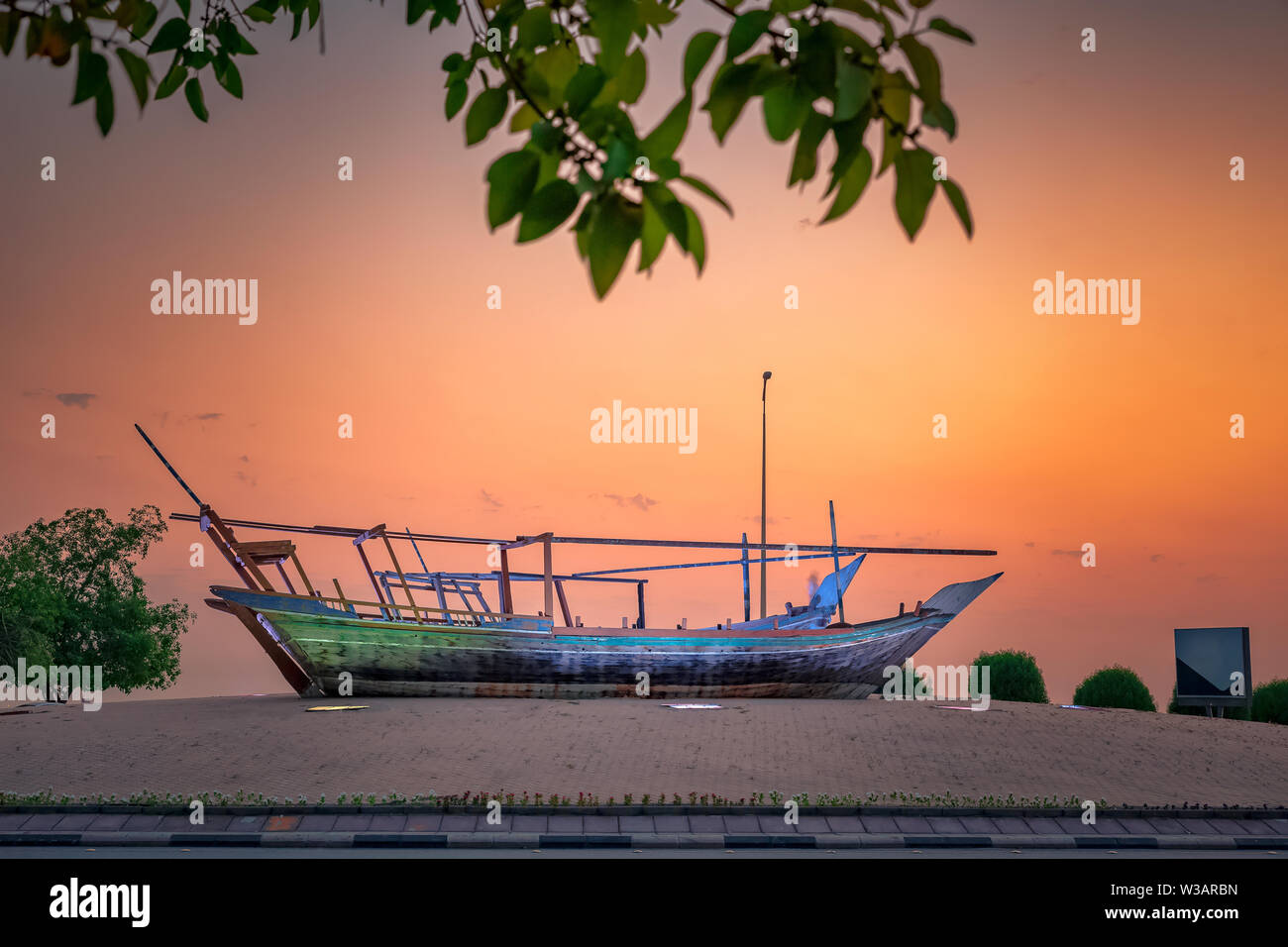 Beautiful Sunrise Boat in seaside with yellow sky background. Dammam -Saudi Arabia Stock Photo