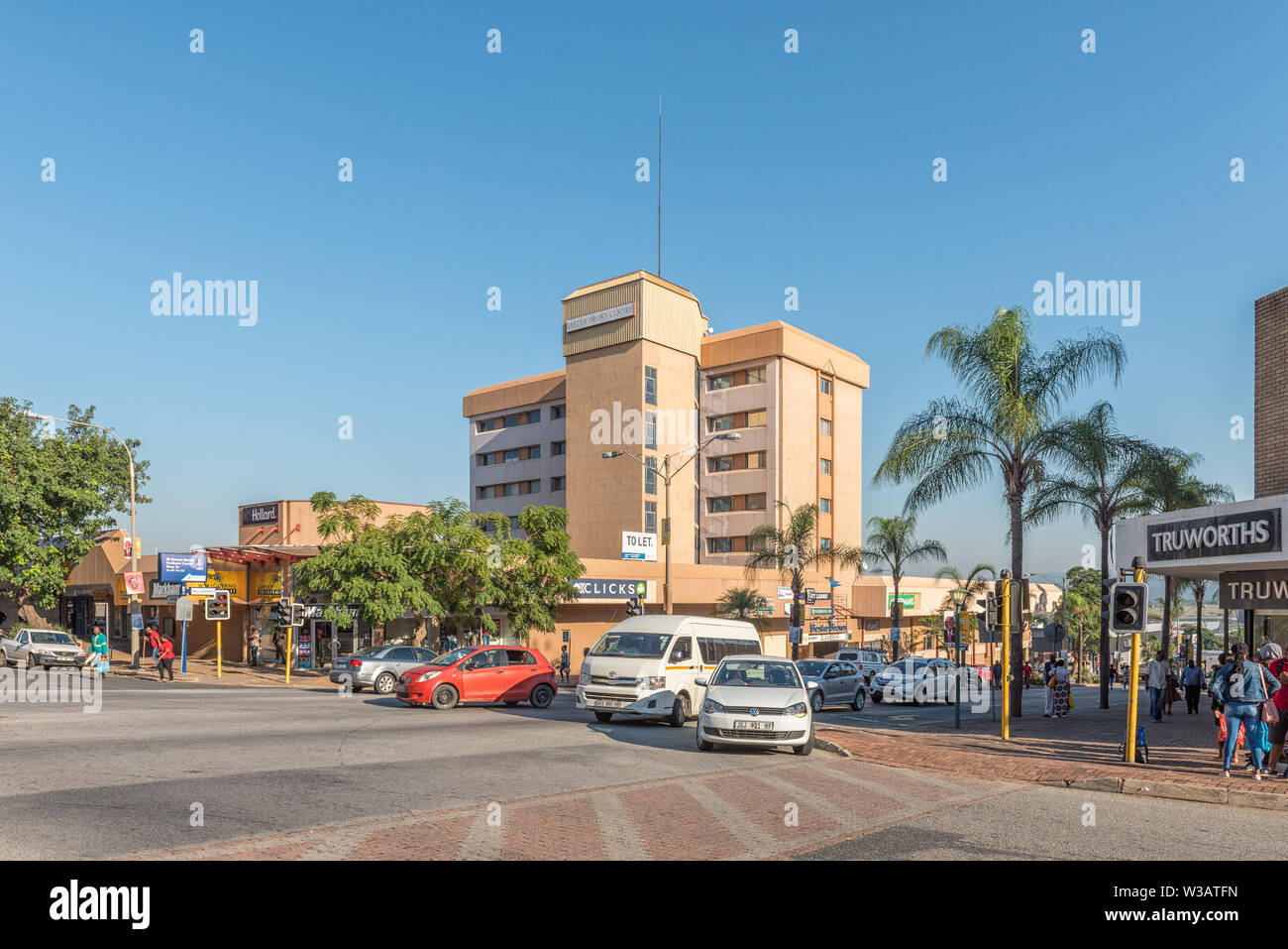 NELSPRUIT, SOUTH AFRICA - MAY 3, 2019: A street scene, with businesses, people and vehicles, in Nelspruit, in the Mpumalanga Province Stock Photo