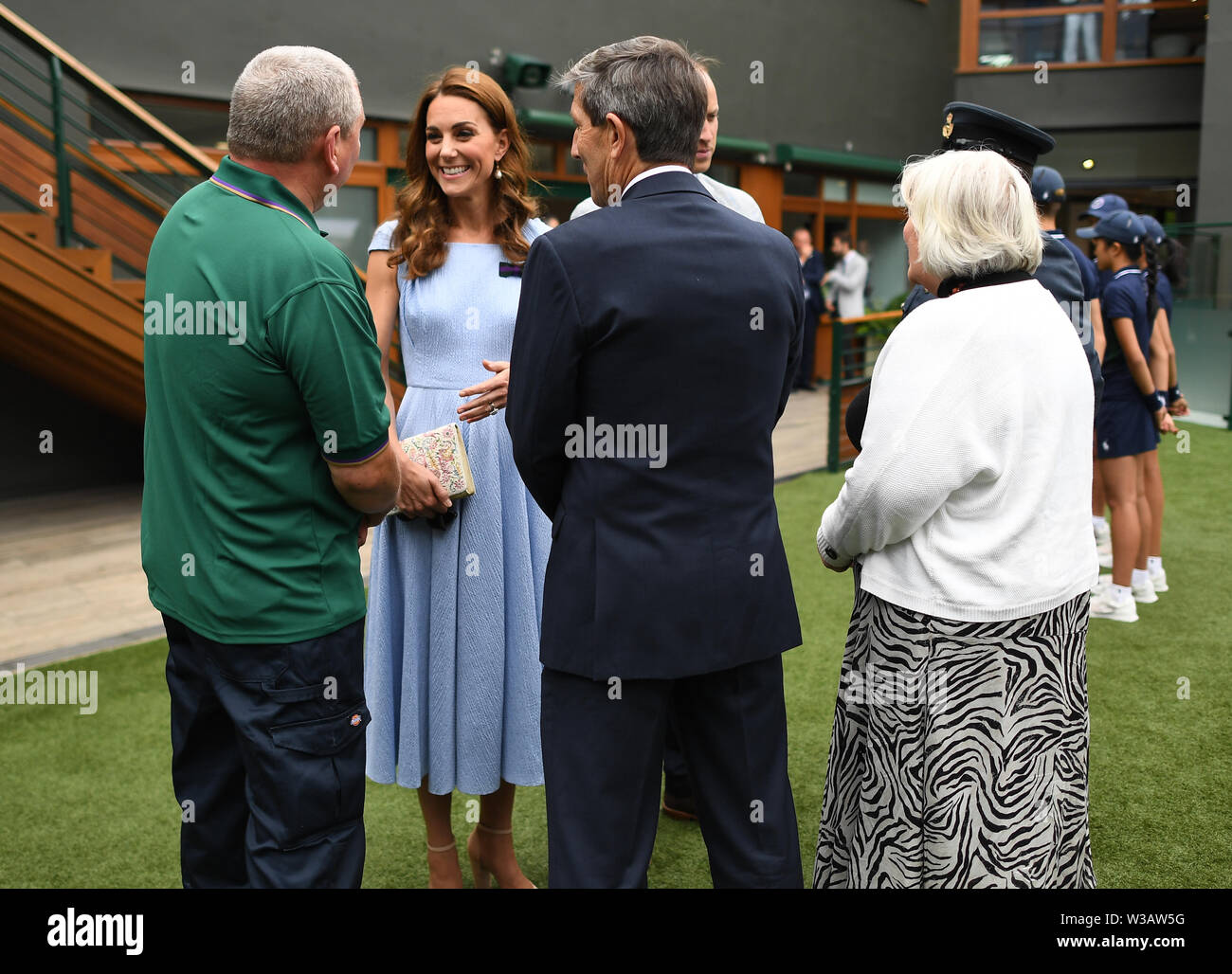 The Duke and Duchess of Cambridge meet (left to right) Mick Woods, from the AELTC facilities management department, referee Andrew Jarrett and Jayne Miller, AELTC ladies dressing room manager, ahead of the Men's Singles Final on day thirteen of the Wimbledon Championships at the All England Lawn Tennis and Croquet Club, Wimbledon. Stock Photo