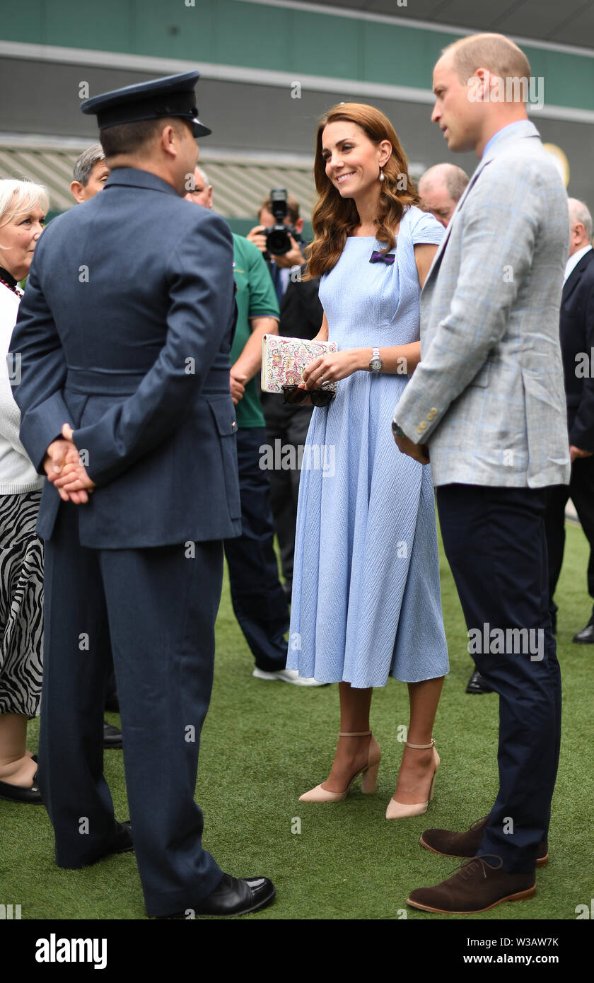 The Duke and Duchess of Cambridge meet Warrant Officer Dave Knights, who is due to retire from the AELTC after 15 years as a Service Steward, ahead of the Men's Singles Final on day thirteen of the Wimbledon Championships at the All England Lawn Tennis and Croquet Club, Wimbledon. Stock Photo