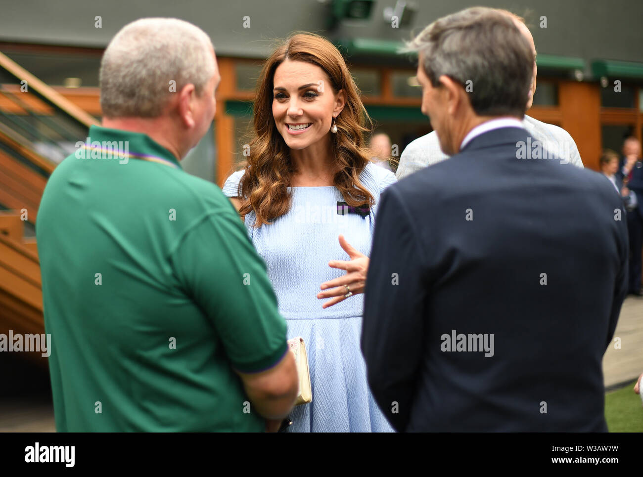The Duke and Duchess of Cambridge meet (left to right) Mick Woods, from the AELTC facilities management department, and referee Andrew Jarrett and Jayne Miller, ahead of the Men's Singles Final on day thirteen of the Wimbledon Championships at the All England Lawn Tennis and Croquet Club, Wimbledon. Stock Photo