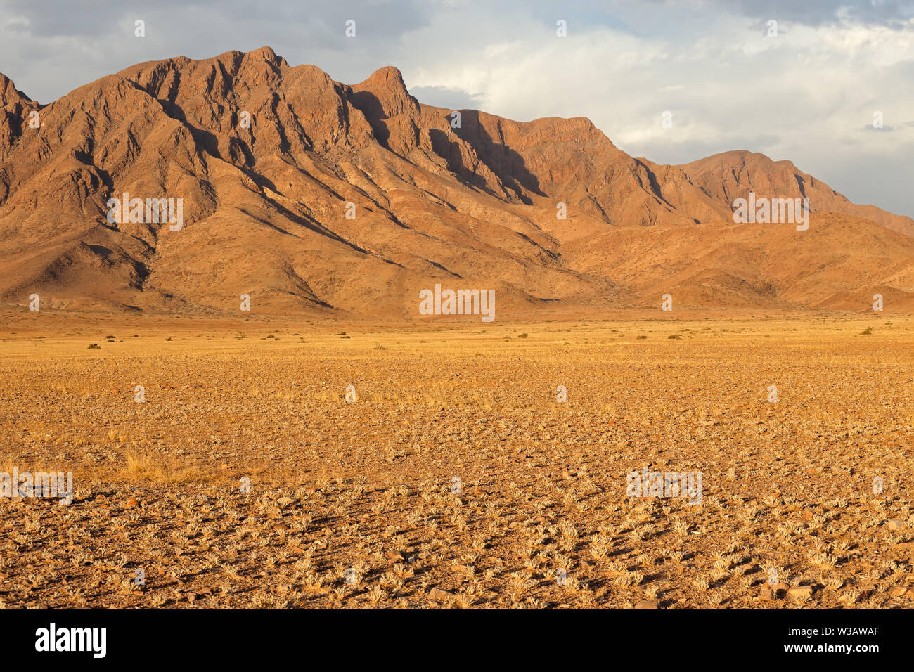 Rugged mountain landscape with cloudy sky, Namib desert, Namibia Stock Photo