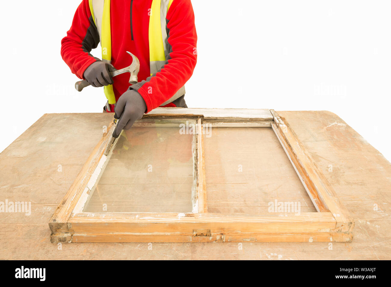 Carpenter Using A Hammer While Repairing And Restoring An Old Window Frame Sash Sash Window Restoration Stock Photo Alamy
