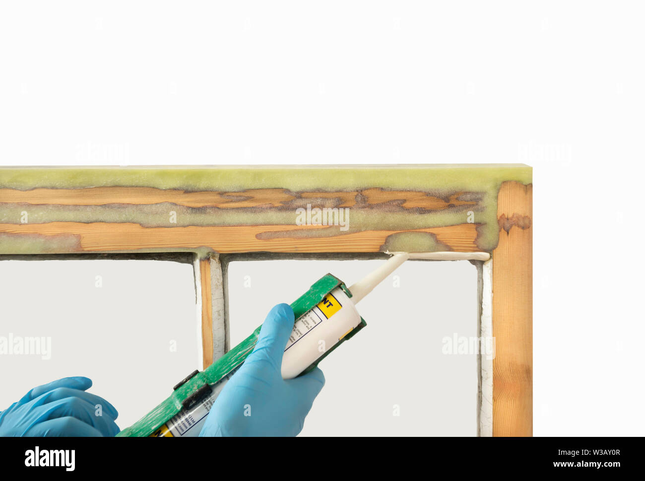 Close up of a person applying dry seal to restored sash windows. Sash