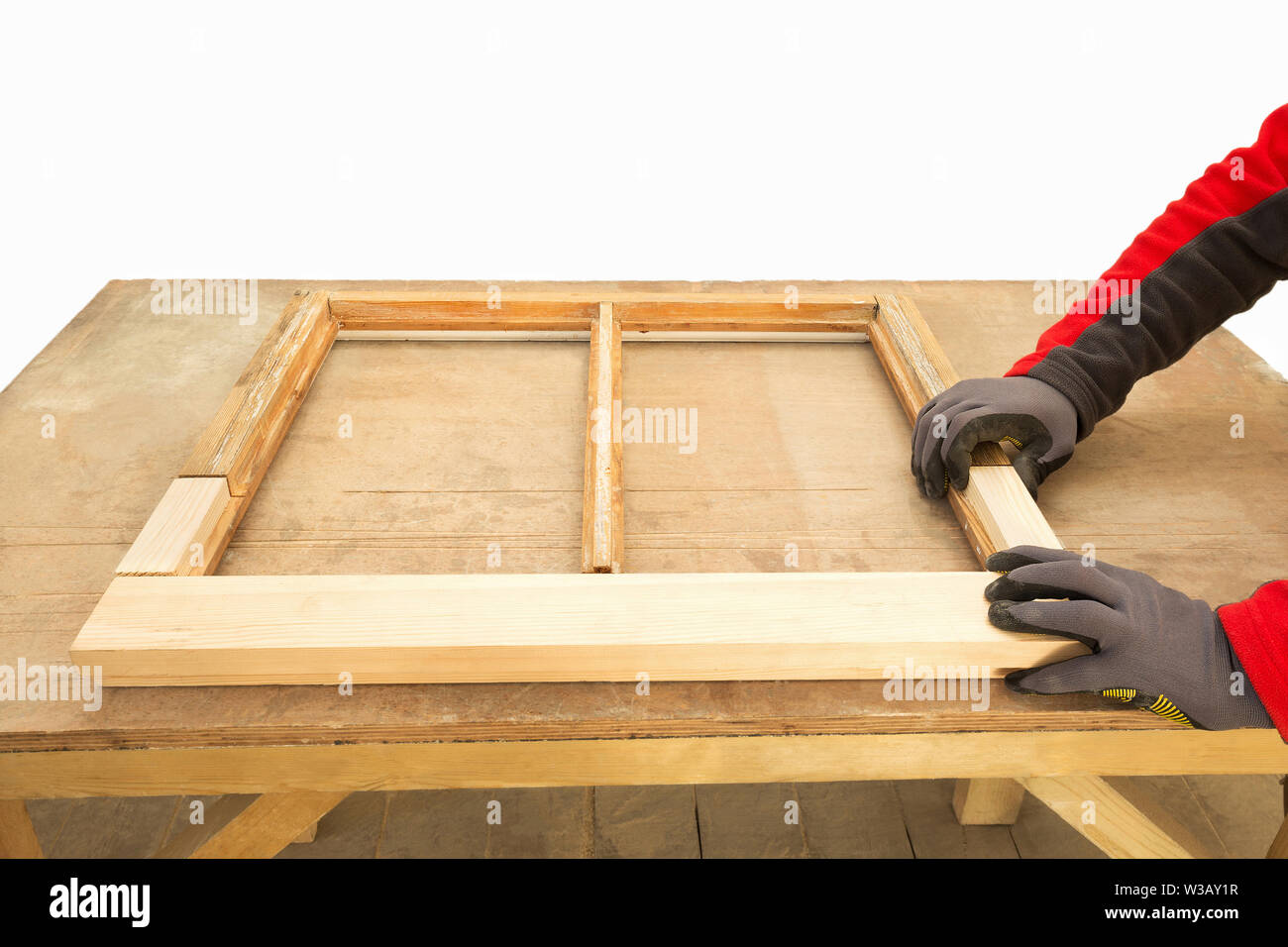 Restoration of a window frame. Close up of a carpenter repairing sash window frame. Sash window restoration. Stock Photo