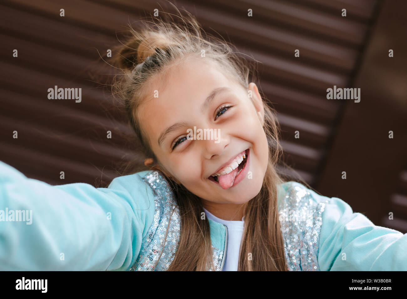 Cute Little Girl Taking A Selfie With A Mobile Phone Outdoor Stock Photo Alamy