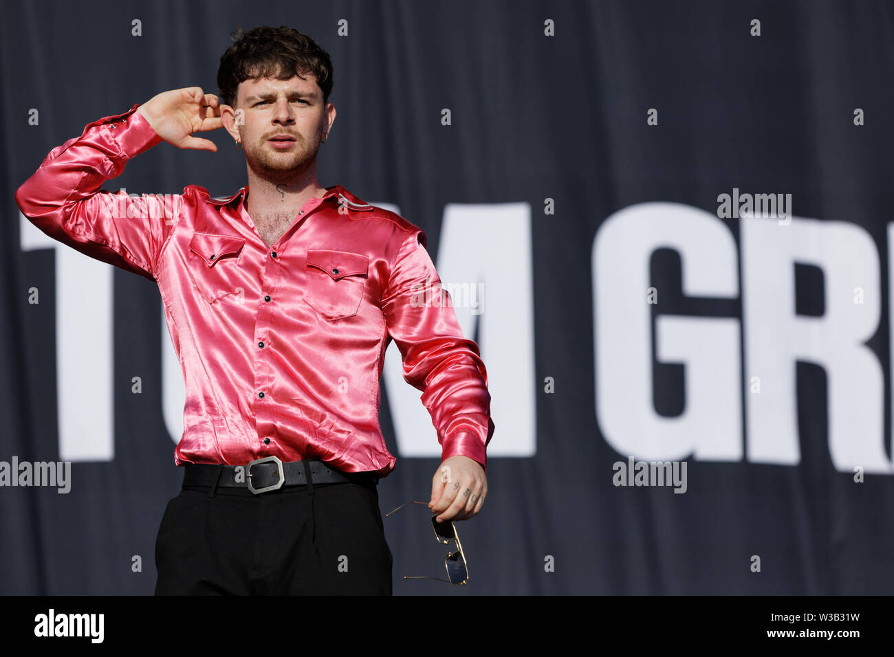 Swansea, UK. 13th July, 2019. Tom Grennan performs on stage. Re: Stereophonics live concert at the Singleton Park in Swansea, Wales, UK. Credit: ATHENA PICTURE AGENCY LTD/Alamy Live News Stock Photo