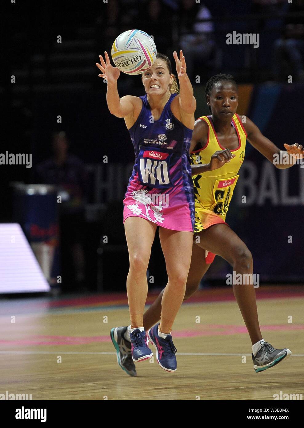 Liverpool, UK. 14 July 2019. Kelly Boyle (Scotland) catches during the Preliminary game between Uganda and Scotland at the Netball World Cup. M and S arena, Liverpool. Merseyside. UK. Credit Garry Bowdenh/SIP photo agency/Alamy live news. Stock Photo