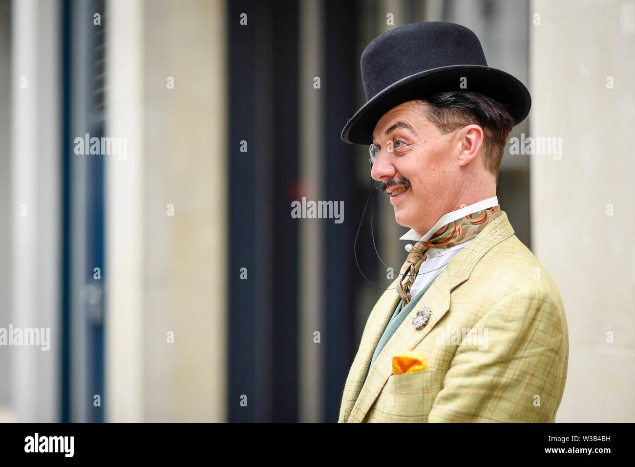 London, UK. 14 July 2019.   An elegantly dressed man takes part in The Grand Flâneur walk.  Starting at the Beau Brummell statue on Jermyn Street, the walk coincides with the 20th anniversary of The Chap magazine and is defined as a walk without purpose, celebrating the art of the flâneur, oblivious to going anywhere specific, and an antidote to the demands of modern life and the digital smartphone.  Similar walks are taking place in Dusseldorf and Los Angeles. Credit: Stephen Chung / Alamy Live News Stock Photo