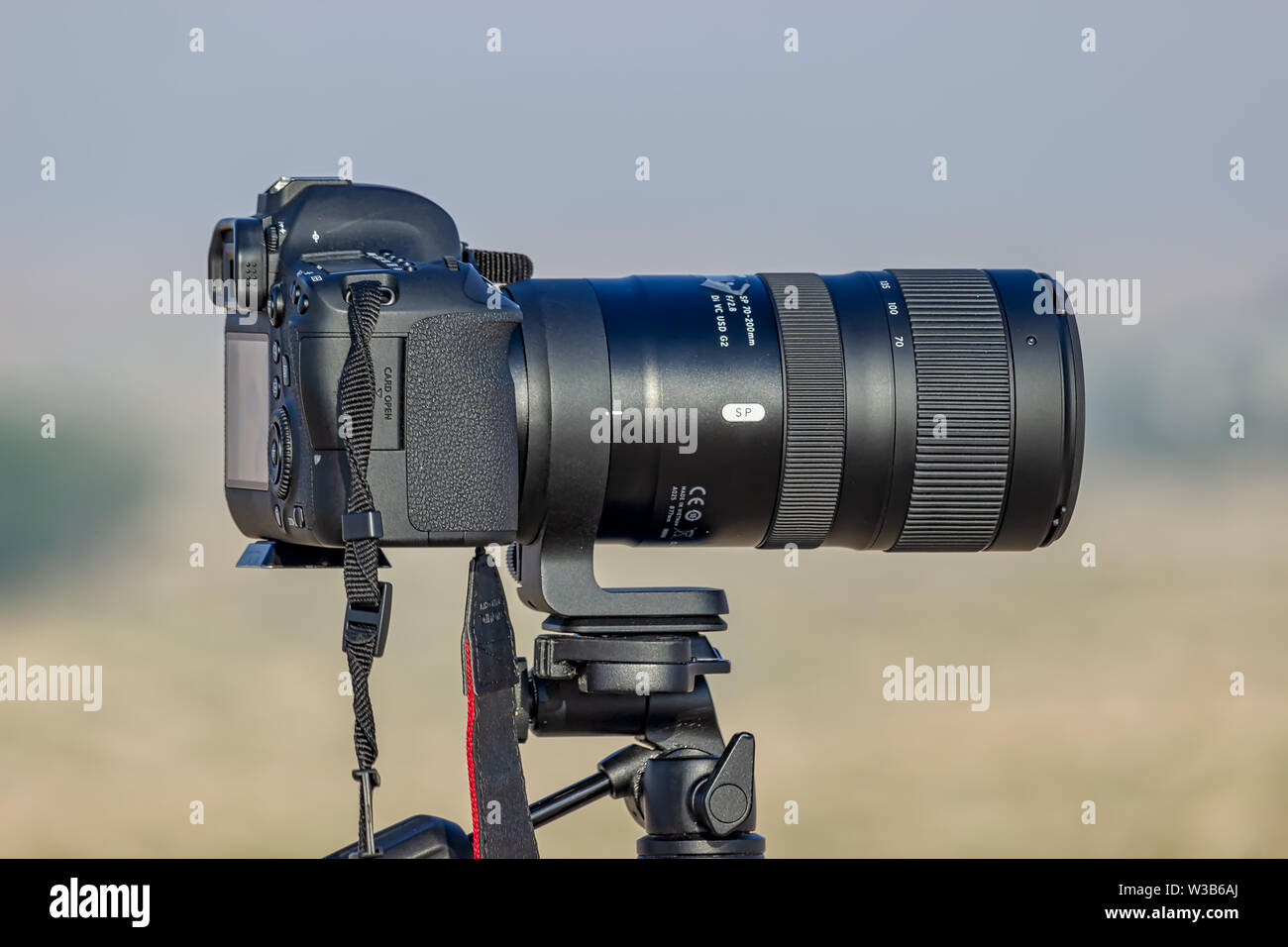 Tele Zoom lens with Camera mounted on the tripod ready for shooting at Desert Winter season. City Dammam Saudi Arabia.Photo taken Month of November -0 Stock Photo