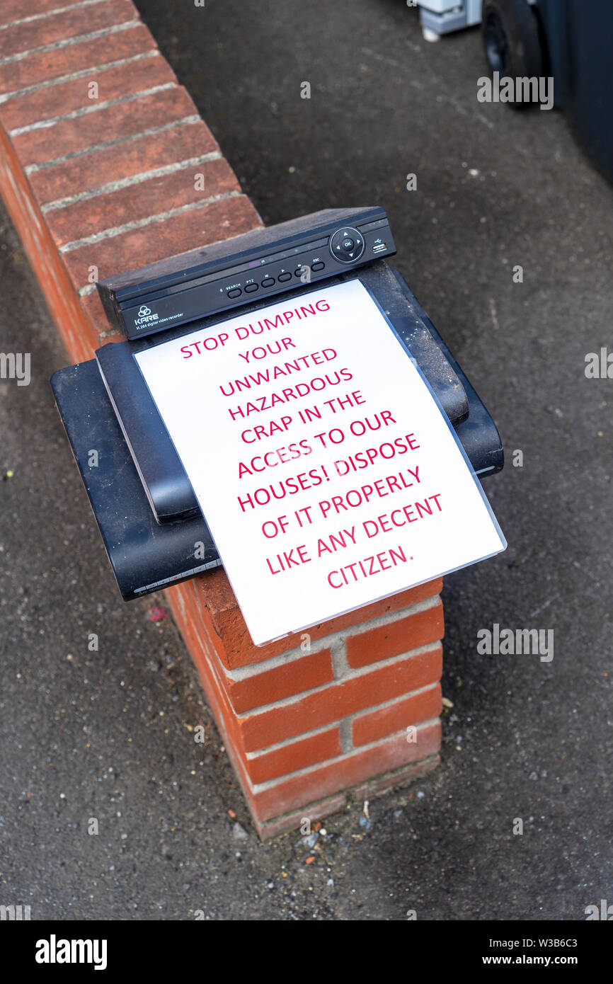 Polite notice about fly tipping hazardous waste Stock Photo