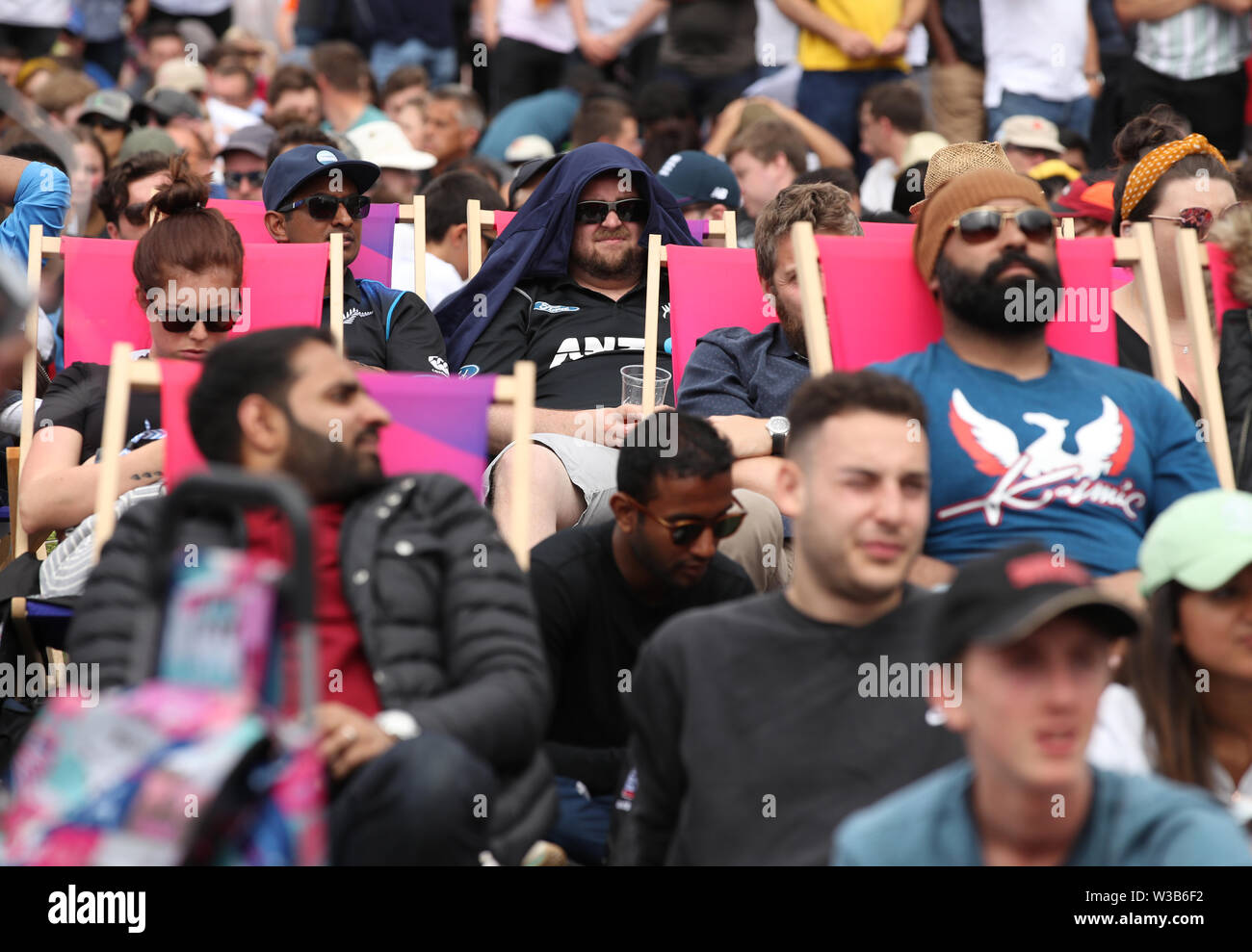 Fans watch a big screen in the Fanzone at Trafalgar Square during the