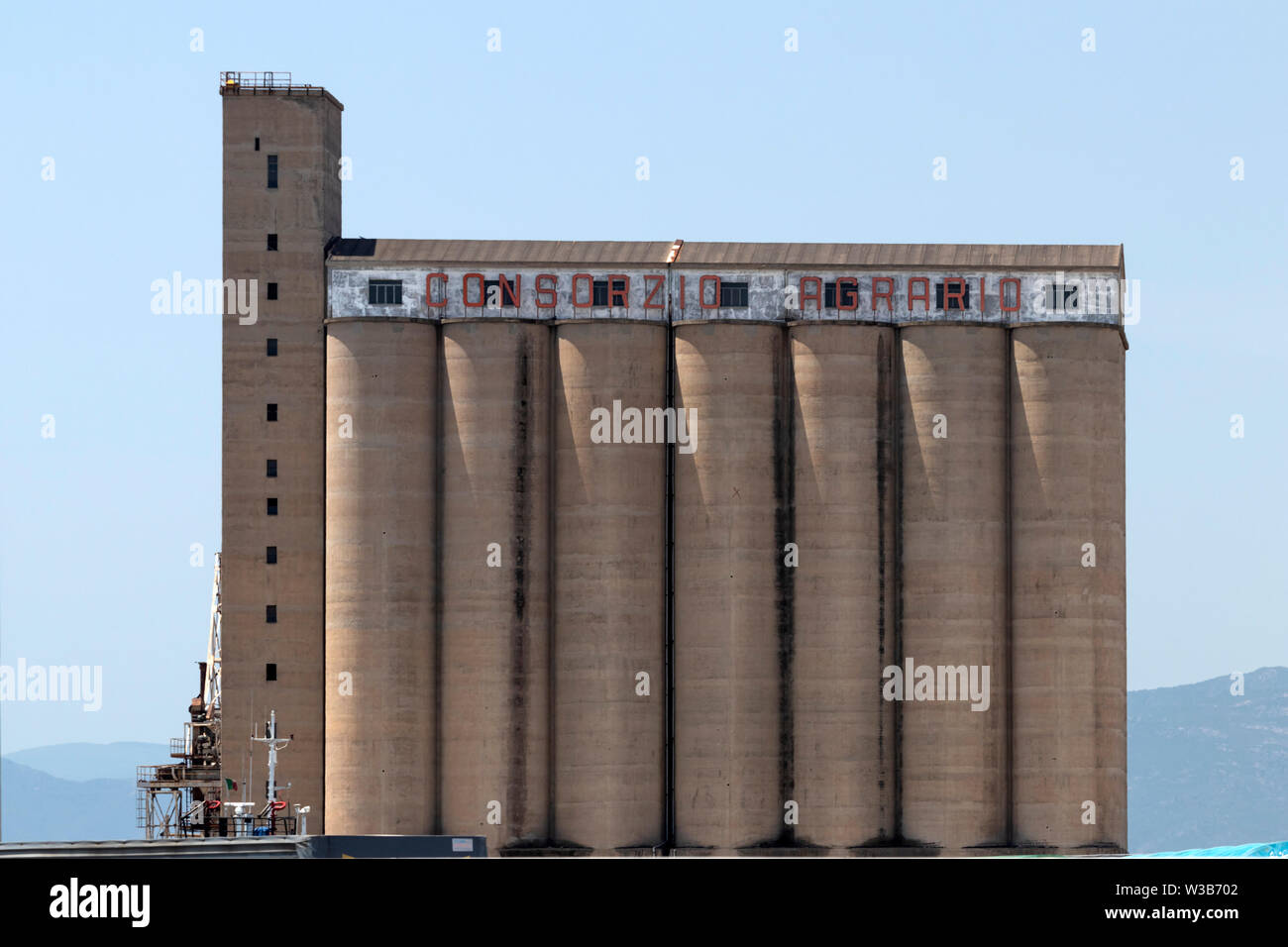 CAGLIARI, ITALY - June 16, 2019: Large concrete grain silos in Cagliari freight port. Stock Photo