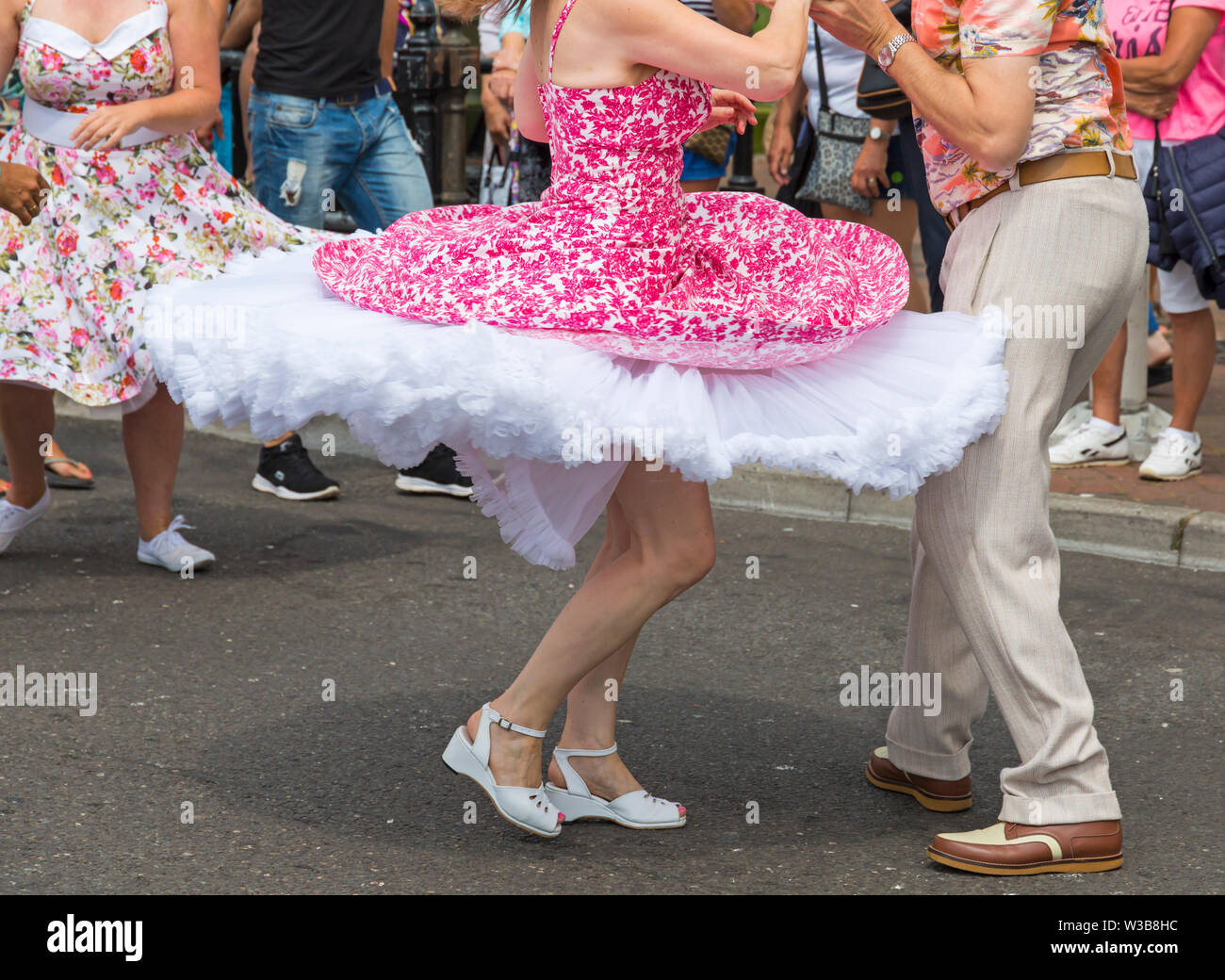 Poole, Dorset, UK. 14th July 2019. Poole Goes Vintage Event takes place on the Quay for a day of vintage music, dance, fashion, memorabilia, entertainment, vehicles and stalls on a 1940's and 1950's theme, including Lindy Hop and Jive on Poole Quay. Thousands turn out to watch, listen and take part. Credit: Carolyn Jenkins/Alamy Live News Stock Photo