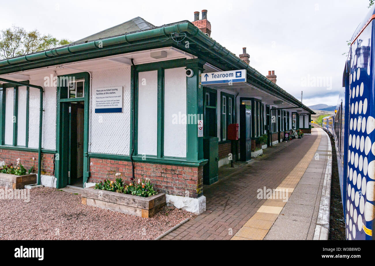 Rannoch rural train station platform with ScotRail train on West