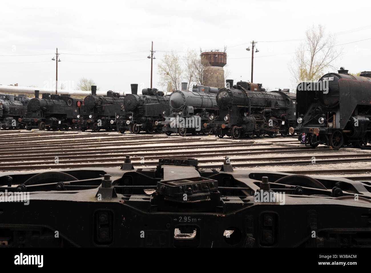 BUDAPEST, HUNGARY - April 05, 2019: Historic steam locomotives on display at the Hungarian Railway Museum. Undercarriage in foreground. Stock Photo