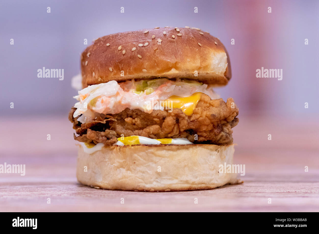 View of a chicken burger with cheddar cheese Stock Photo - Alamy