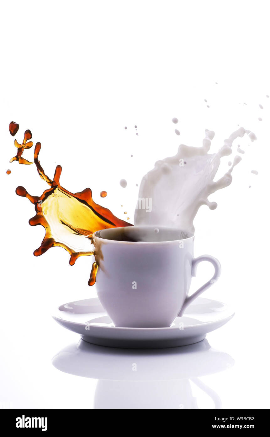 A lively cup of coffee and milk with splash isolated on white background Stock Photo