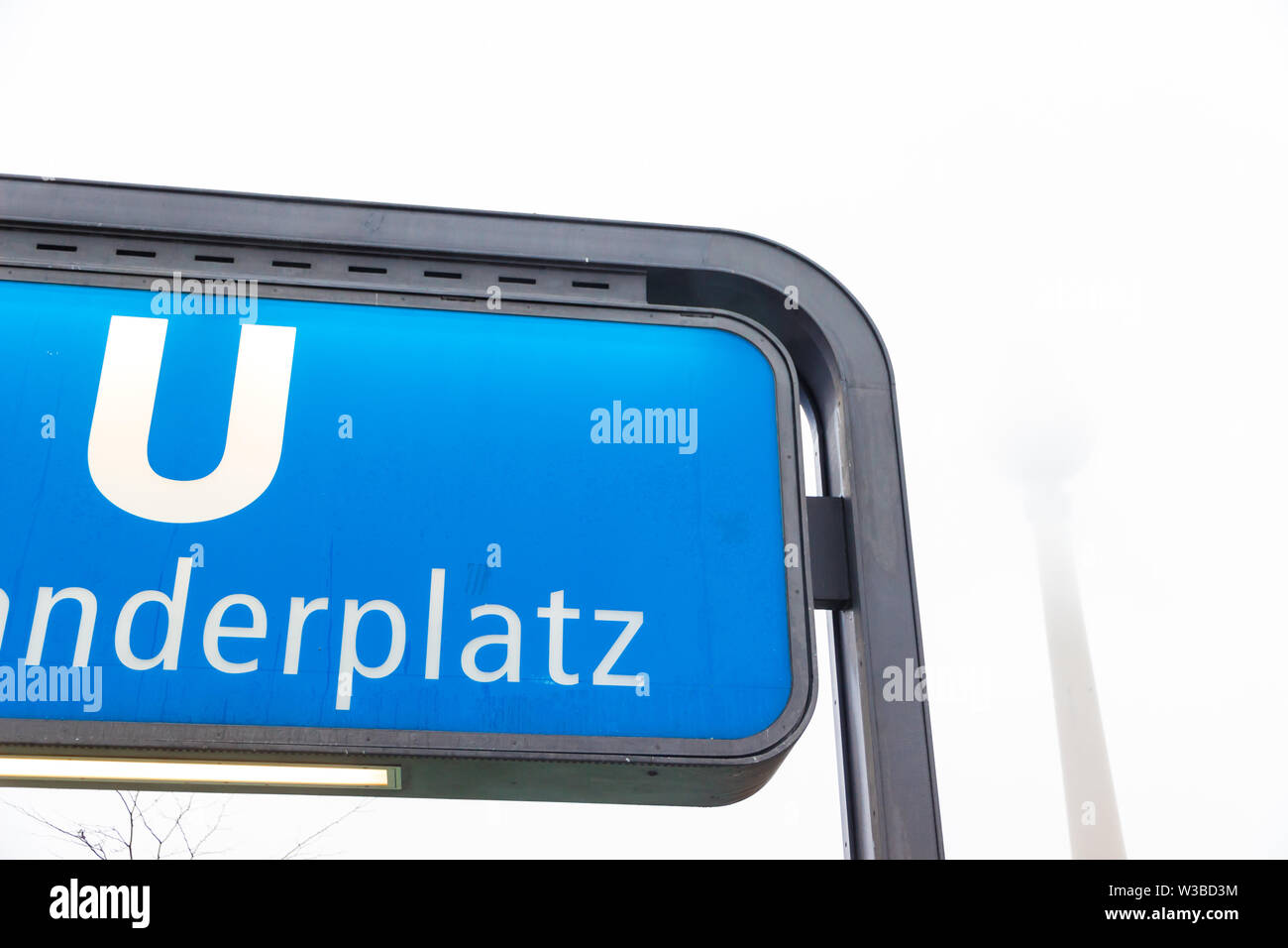 Berlin, Germany - December 21, 2017. Alexanderplatz subway station sign in winter in a foggy day Stock Photo