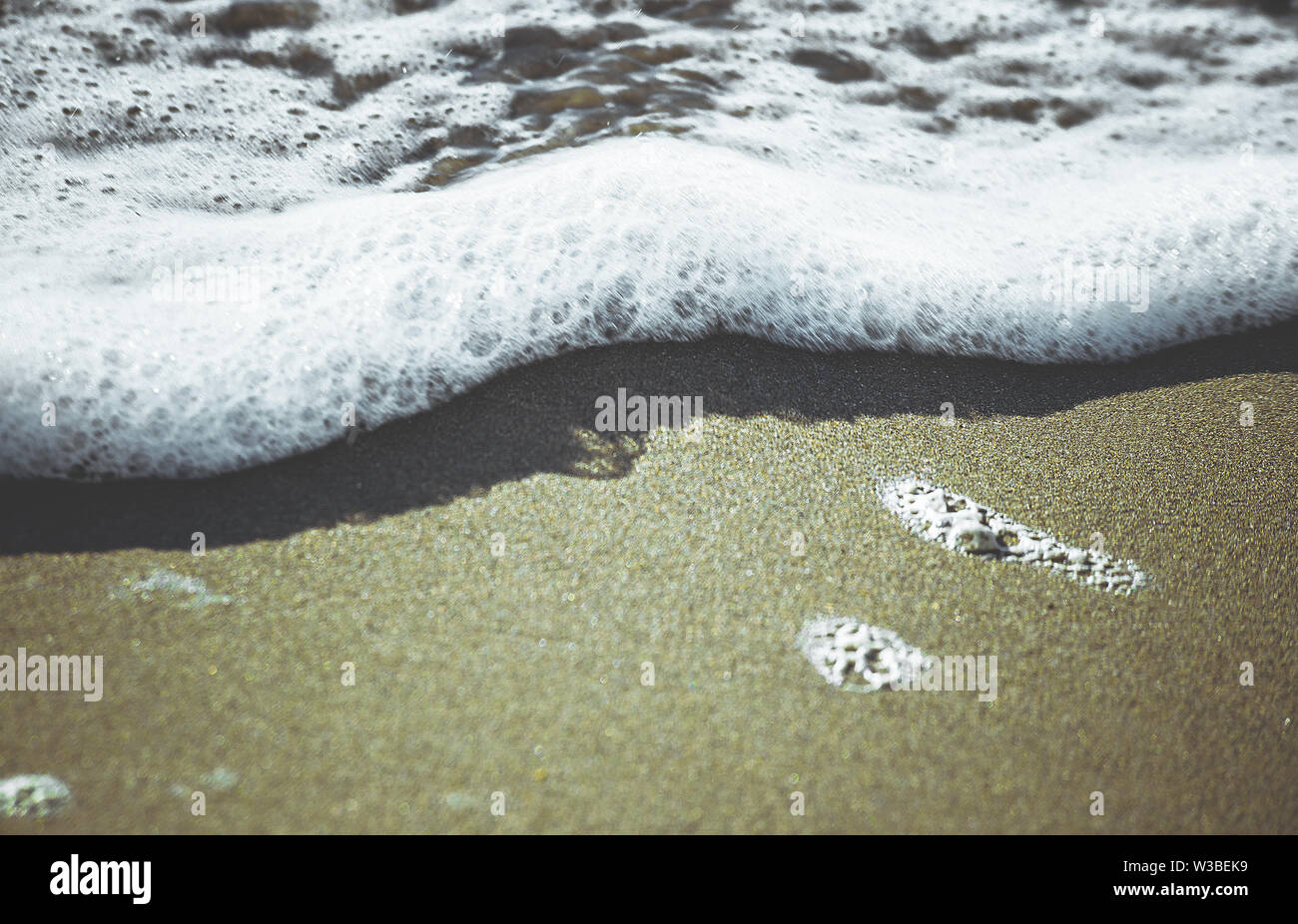 surf in sandy sea beach Stock Photo