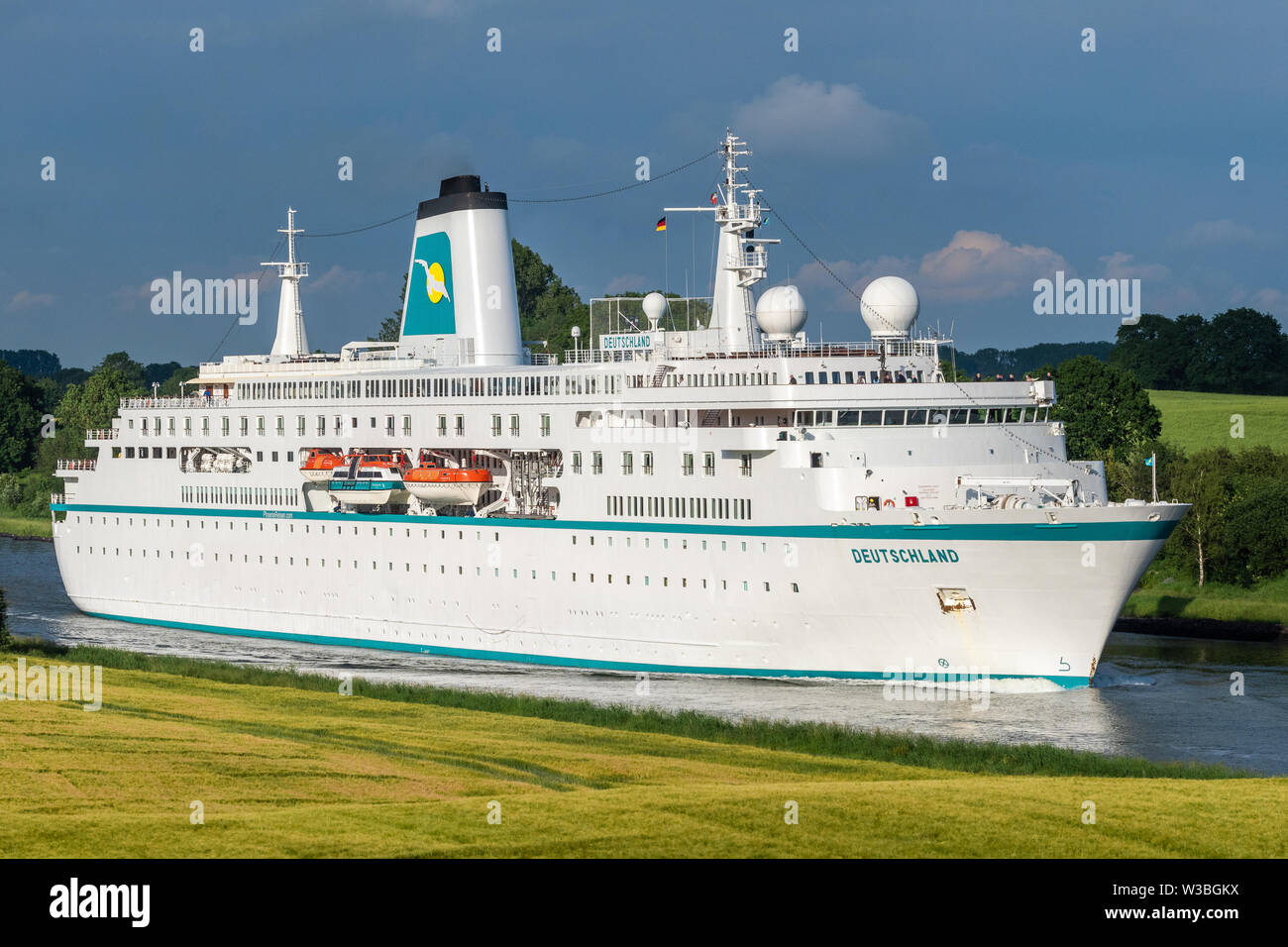 Cruiseship Deutschland navigating through the Kiel Canal Stock Photo
