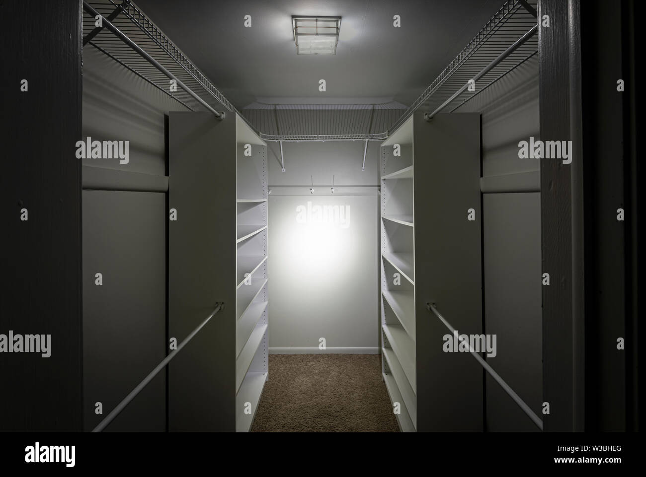 Empty Closet With Glowing Light Stock Photo