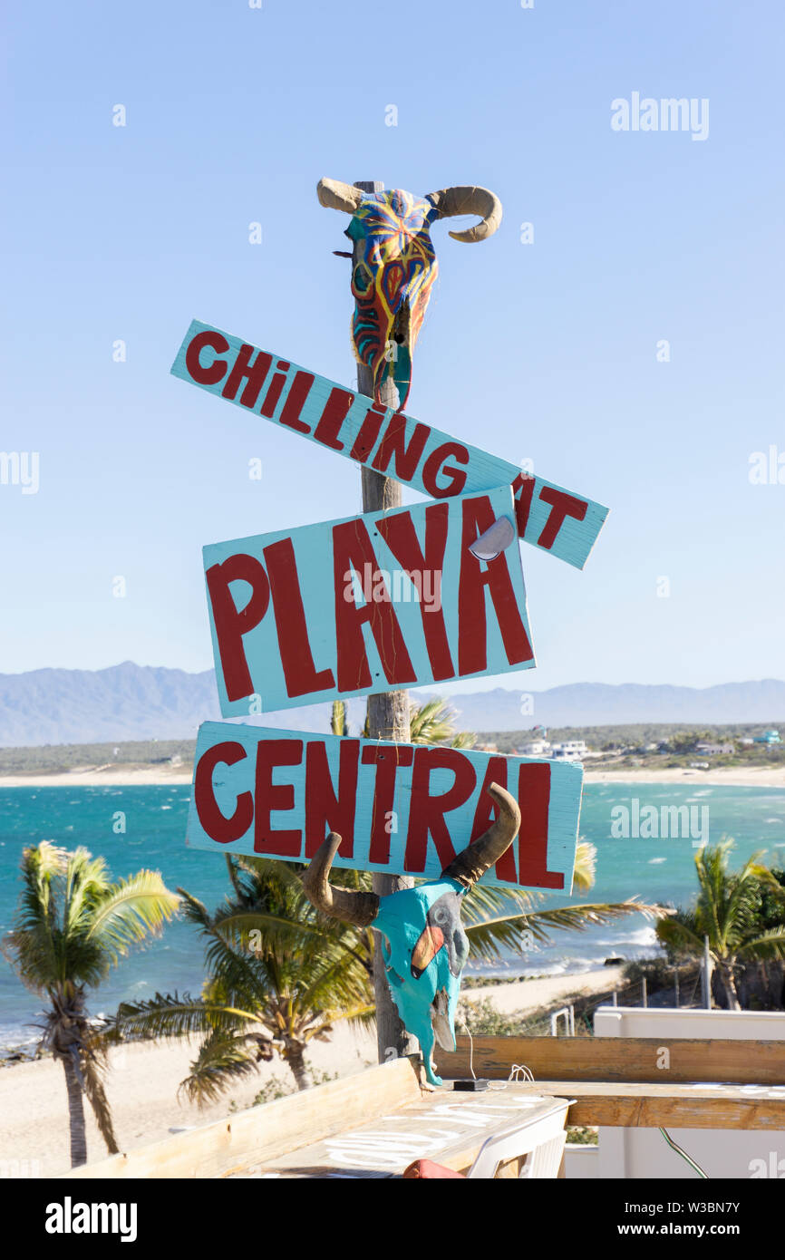 chilling on the beach sign with a skull on top Stock Photo - Alamy