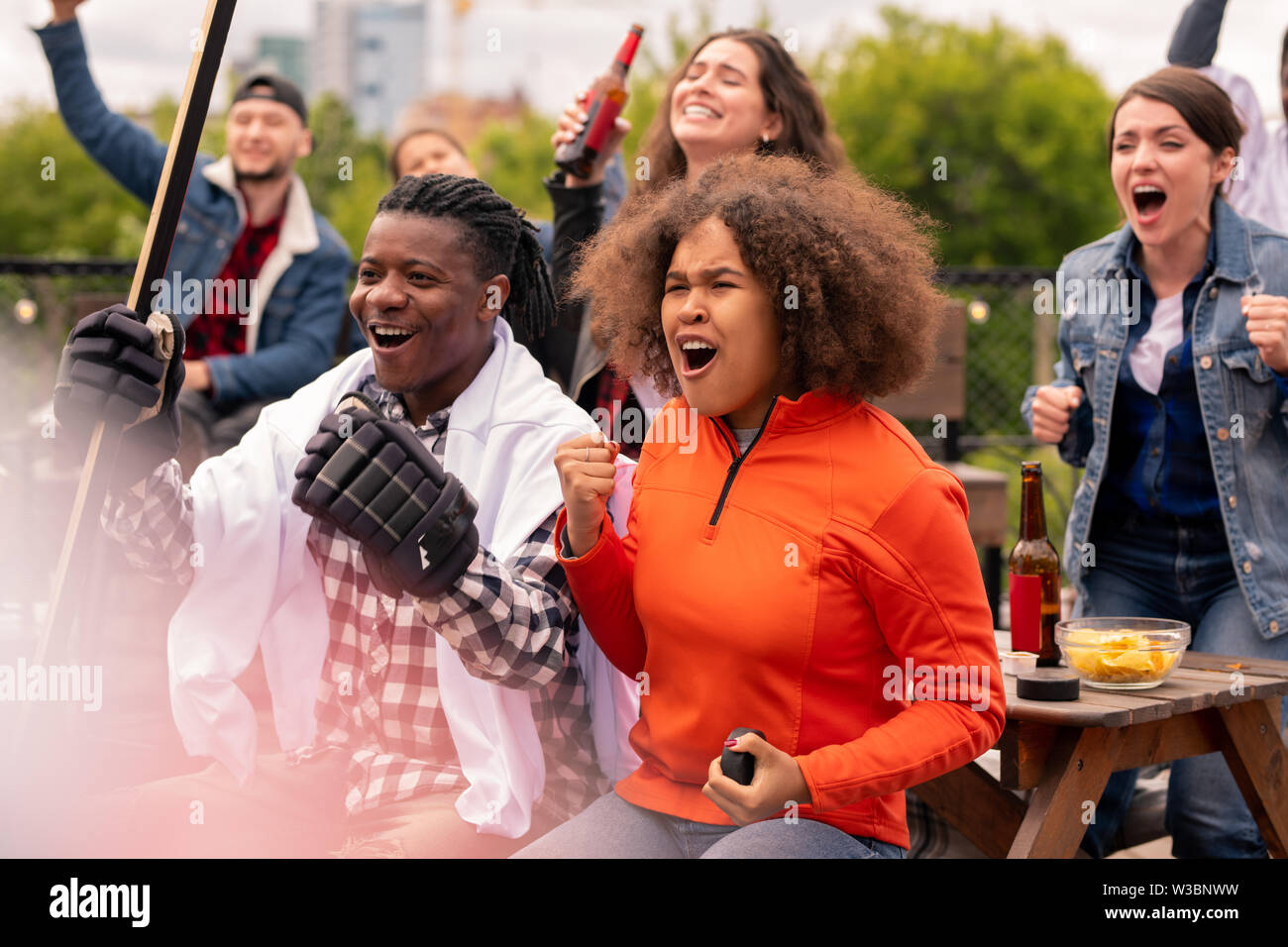 Young hockey fans expressing gladness about their favorite team victory Stock Photo