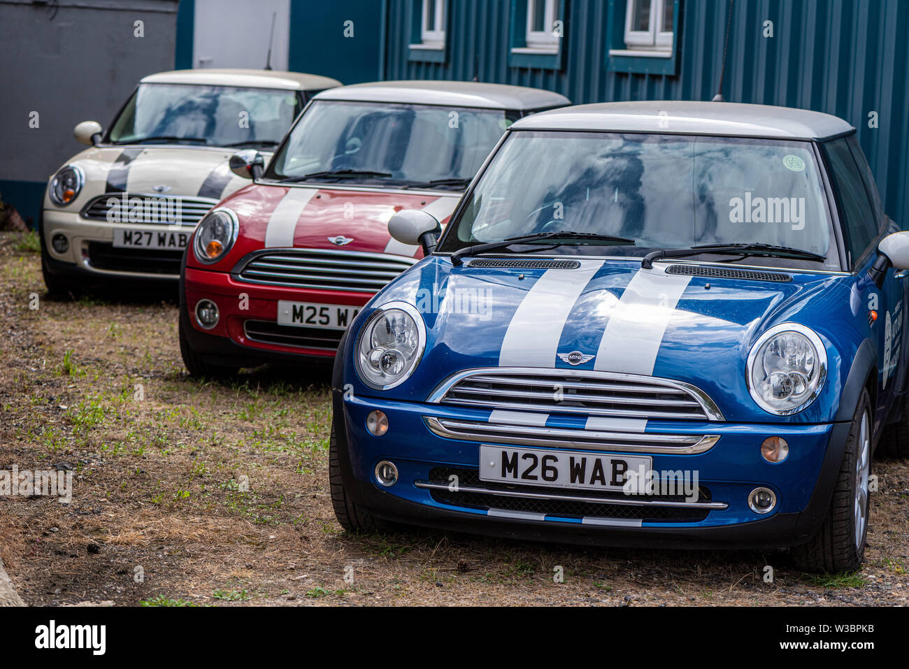 Red, white and blue Minis at Autofest, Winchester Auto Barn, Sutton Scotney, Hampshire, UK Stock Photo