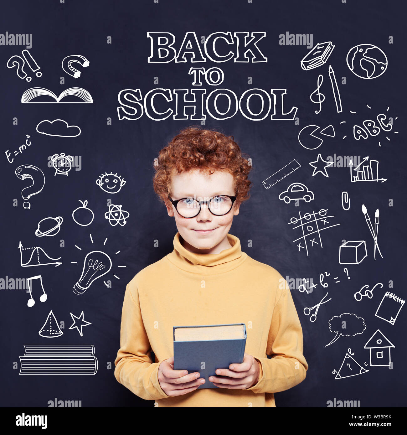 Kid with book, back to school concept Stock Photo