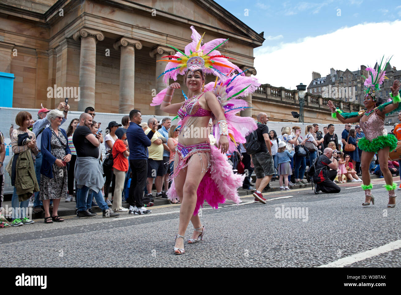 Edinburgh, Scotland, UK.14th July 2019. Edinburgh Festival Carnival 2019. More than 800 performers took part in the colourful parade from the top of The Mound down through Princes Street and into Princes Street Gardens West to continue the party atmosphere with world class music and dance to entertain the crowds who attended and lined the streets. Stock Photo