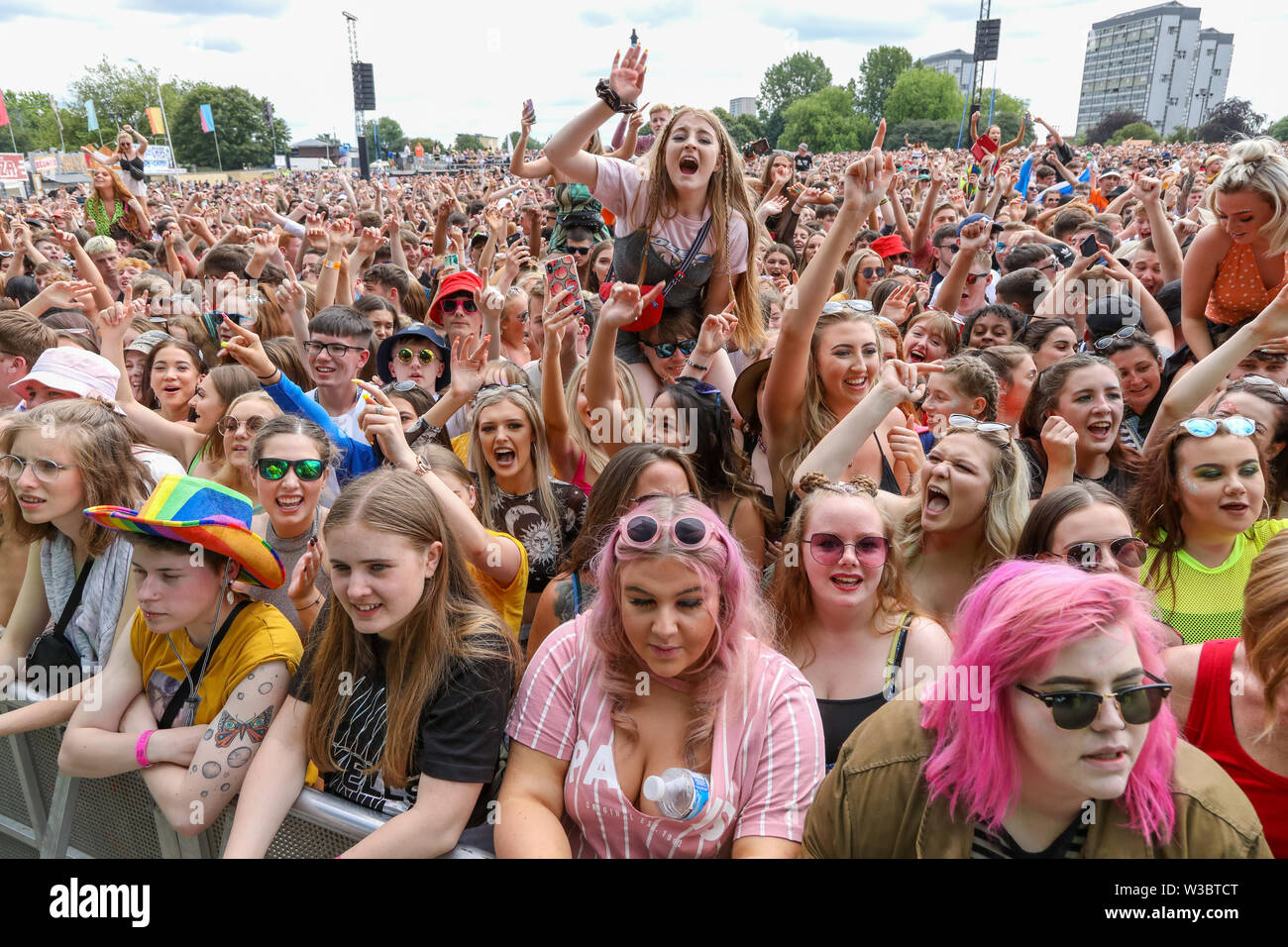 Glasgow, Scotland, UK. 14th July 2019. Thousands of music fans turned out at Glasgow Green, Glasgow, UK in a hot summers day, making this years TRNSMT festival  sell out. Many of the audience have travelled from all parts of the UK and sometimes beyond just to enjoy the music and experience Credit: Findlay/Alamy Live News Stock Photo