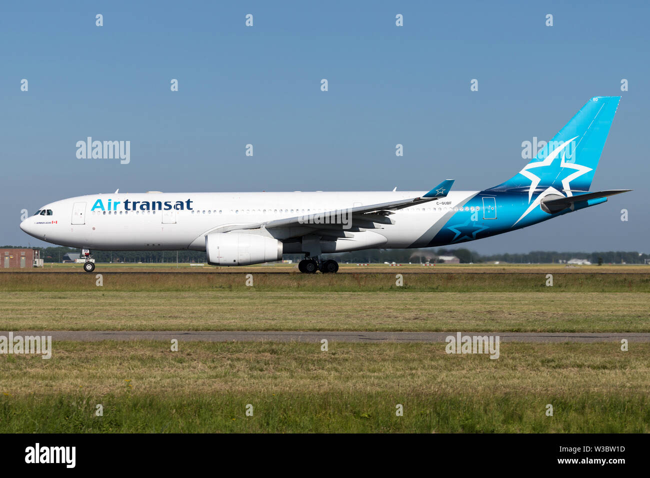 Canadian Air Transat Airbus A330-200 with registration C-GUBF on take off roll on runway 36L (Polderbaan) of Amsterdam Airport Schiphol. Stock Photo