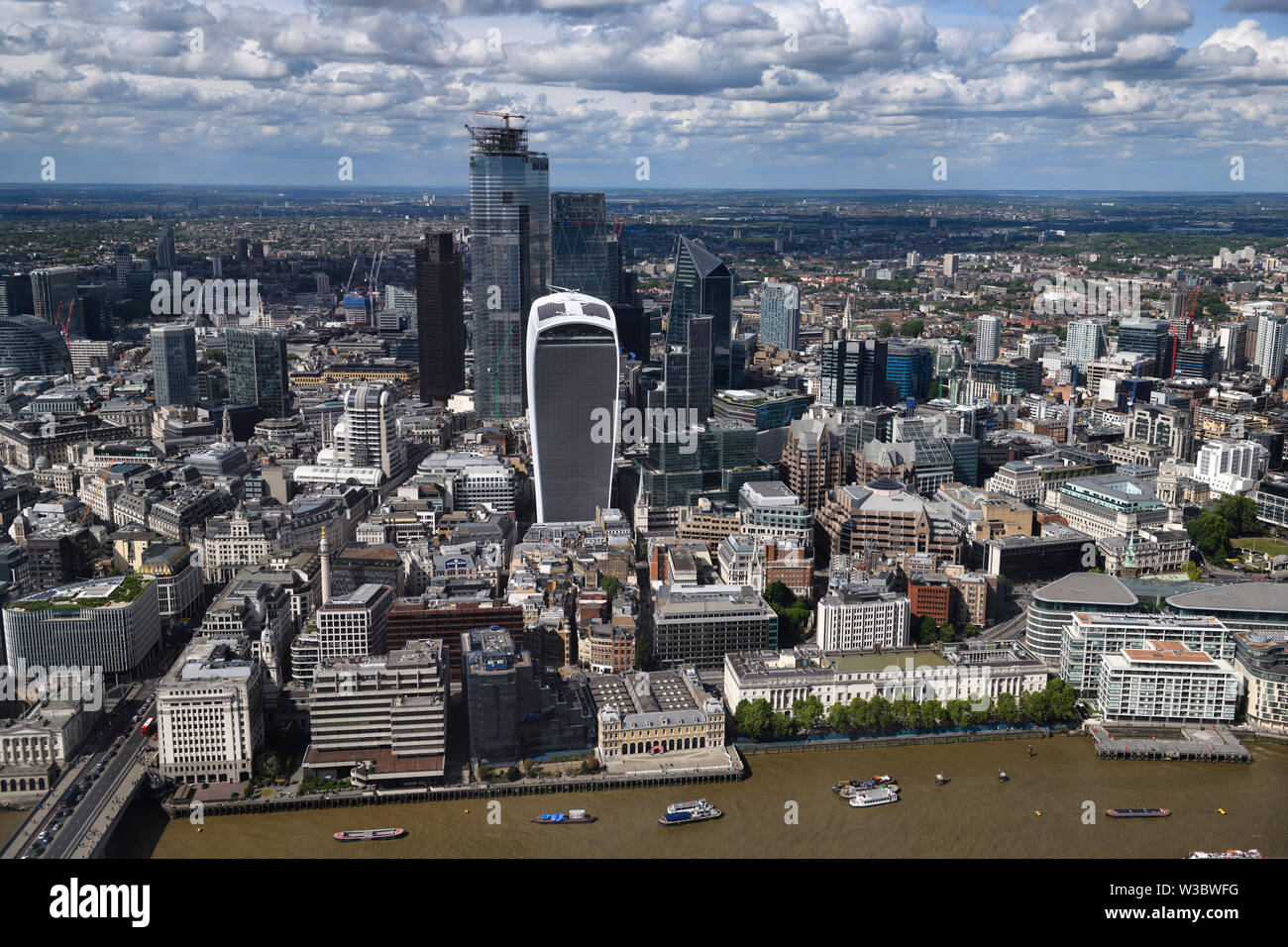 Aerial view of financial district skyscrapers Walkie Talkie Cheesegrater Scalpel on the River Thames at London Bridge London England Stock Photo
