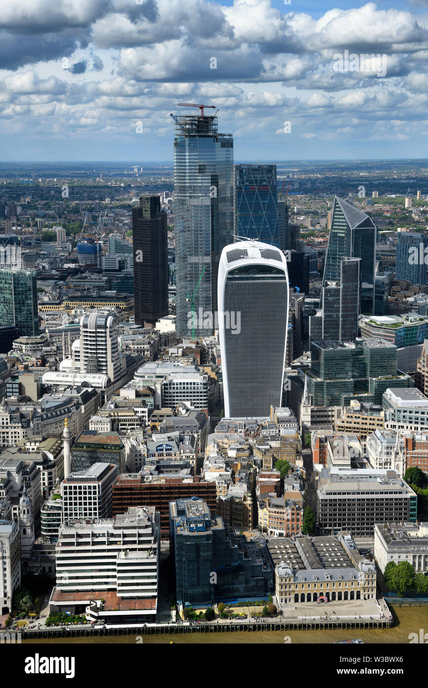 Aerial view of financial district skyscrapers Bishopsgate construction Walkie Talkie Cheesegrater Scalpel on River Thames at London Bridge England Stock Photo