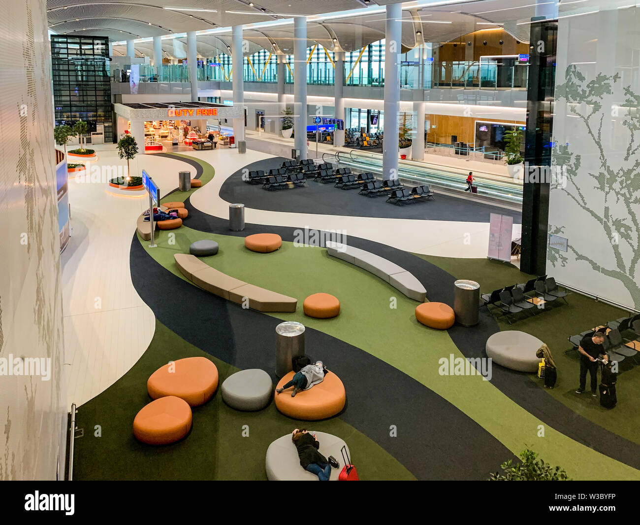 Interior design with many passenger seats of the New Airport (IST) that freshly opened and replaces Ataturk International Airport. Istanbul/ Turkey - Stock Photo