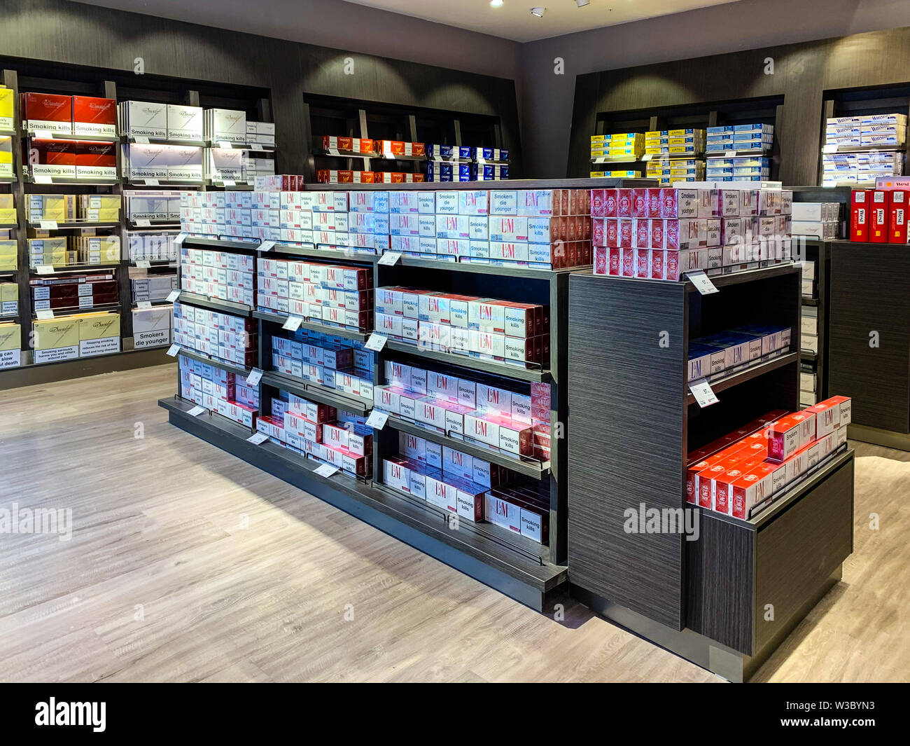 Cigarettes department at a duty free segment store with many pick packs on sale. Concept of duty free shops. Istanbul/ Turkey - April 2019 Stock Photo