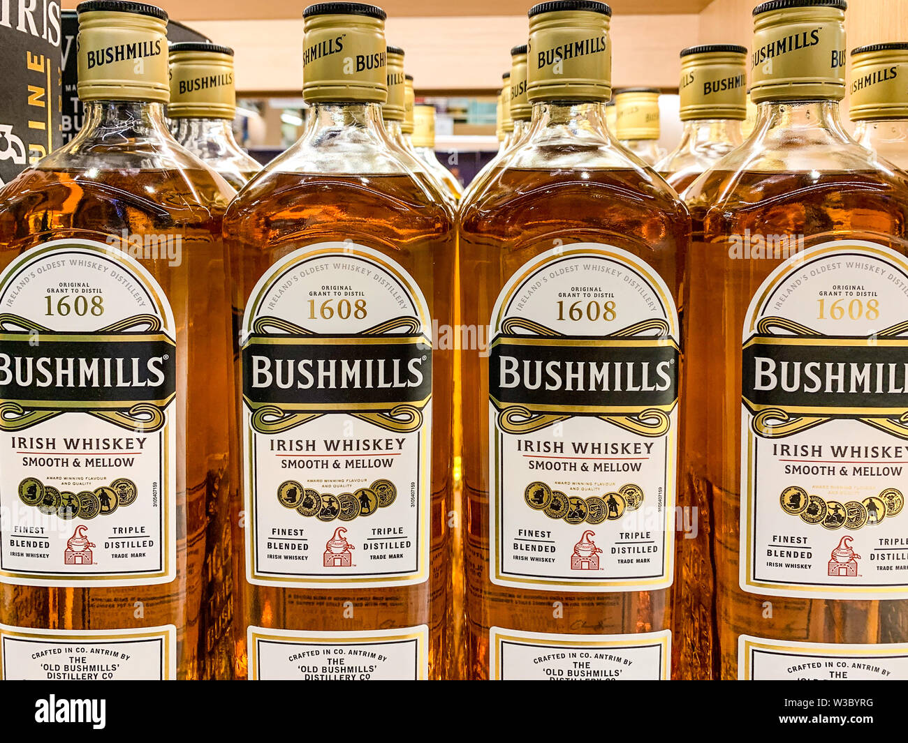 Bottles of Bushmills on display in a shop. The Old Bushmills Distillery is a whiskey distillery in Bushmills, County Antrim, Northern Ireland. Istanbu Stock Photo